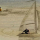 Illustration for article titled These 3D sand drawings create fun trippy illusions on the beach
